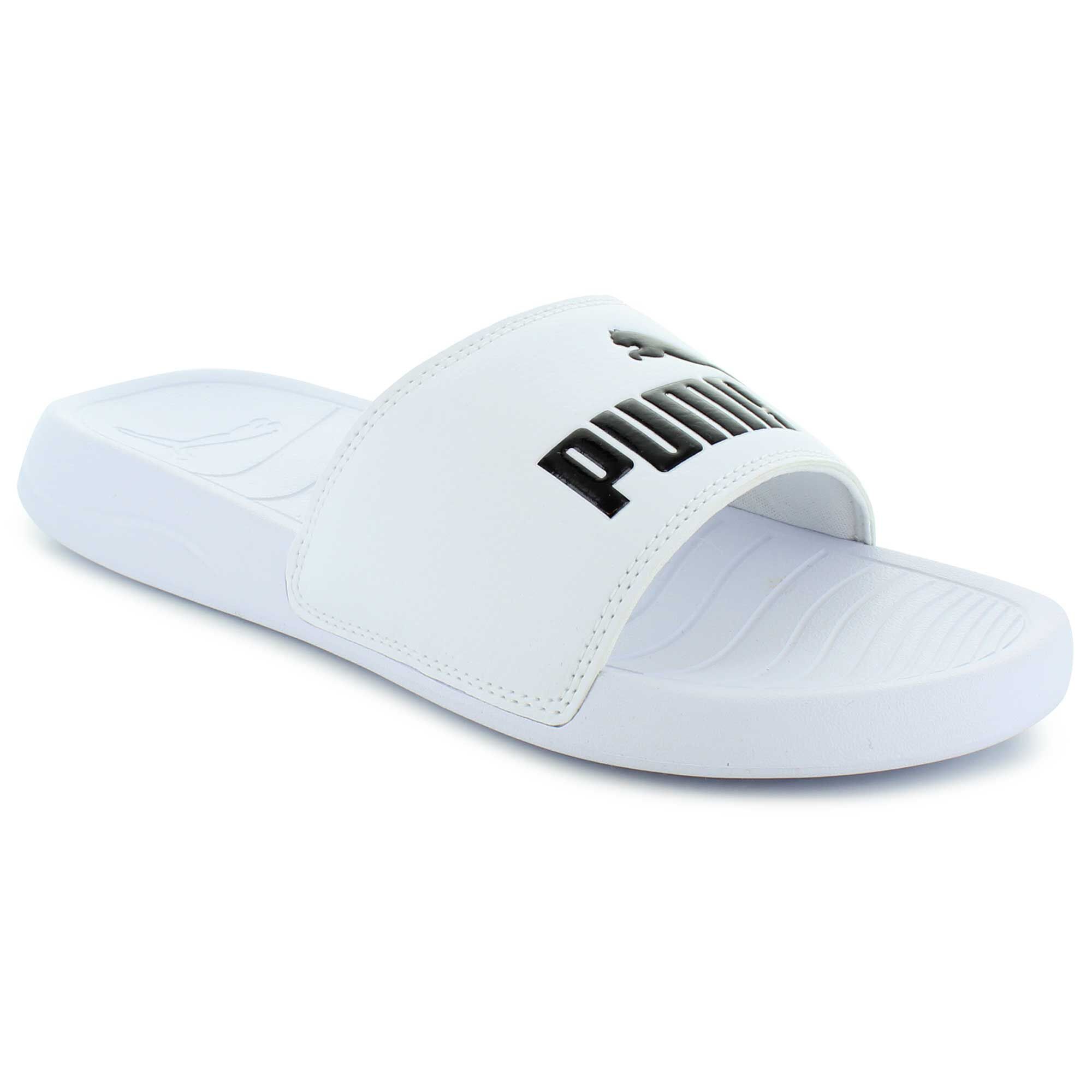 white and clear puma slides